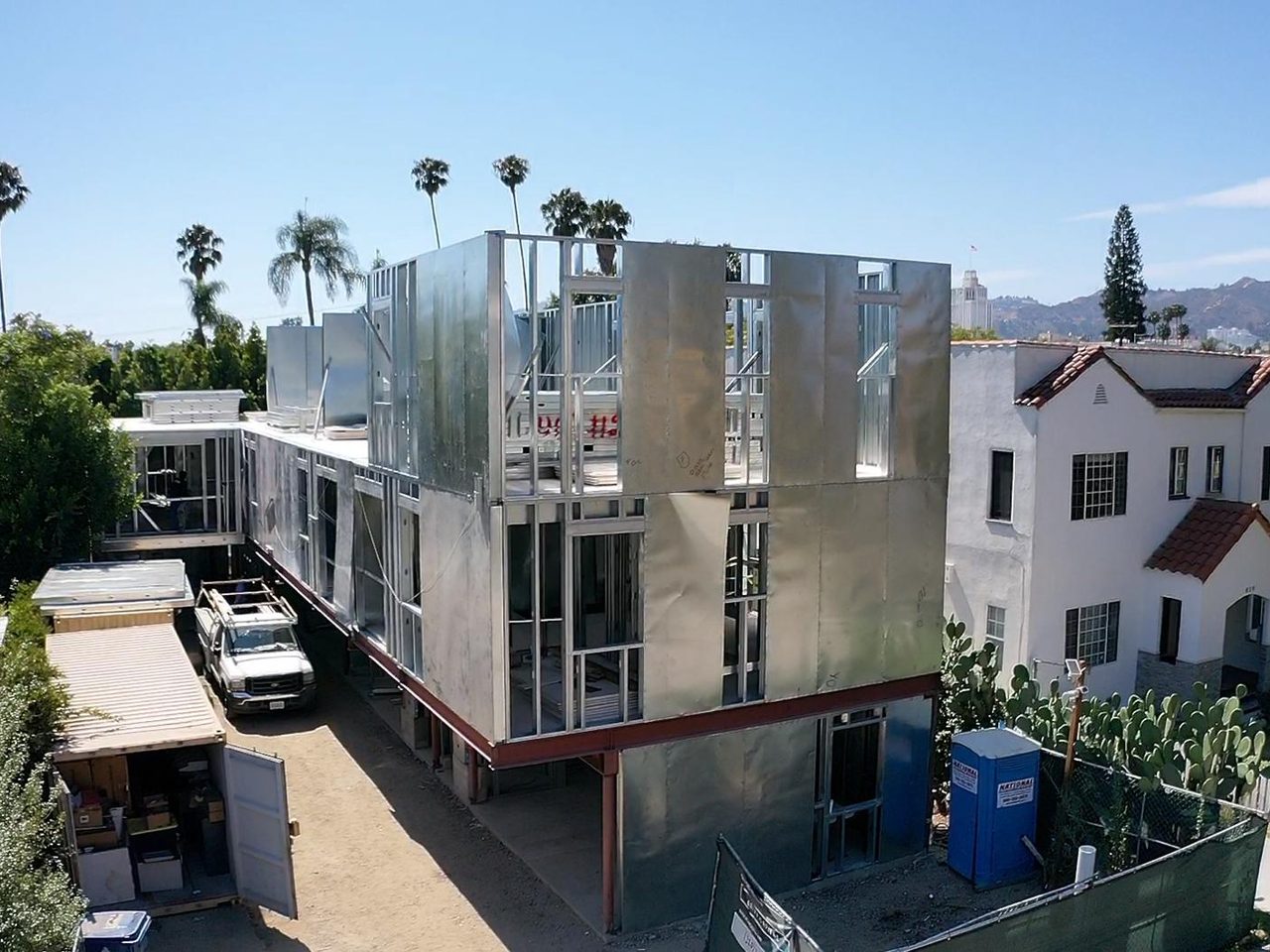 A completed multi-story light gauge steel frame in a Los Angeles neighborhood