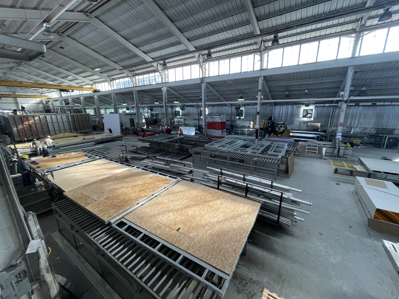 Master steel coils and the slitting line on the Cal Steel production floor.