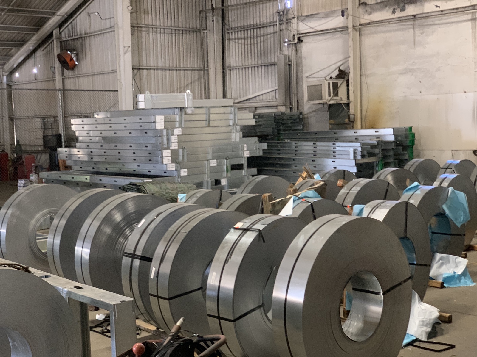 Master steel coils and the slitting line on the Cal Steel production floor.