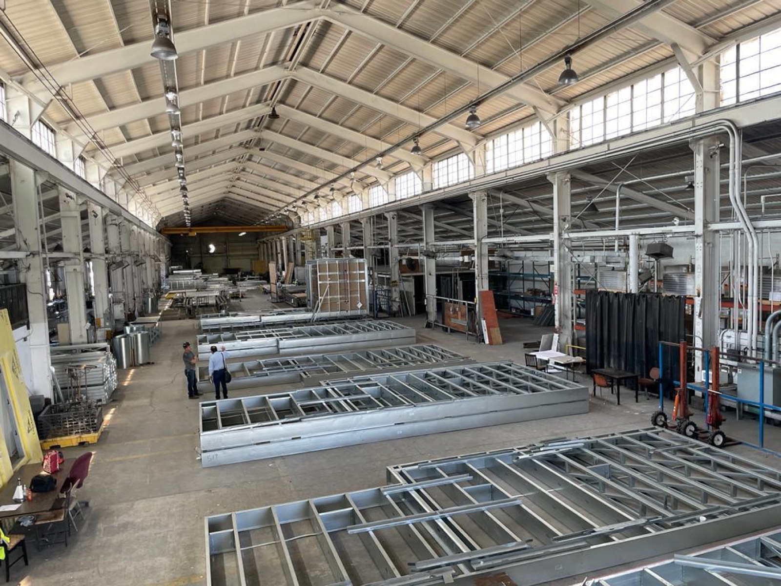 Master steel coils and the slitting line on the Cal Steel production floor.