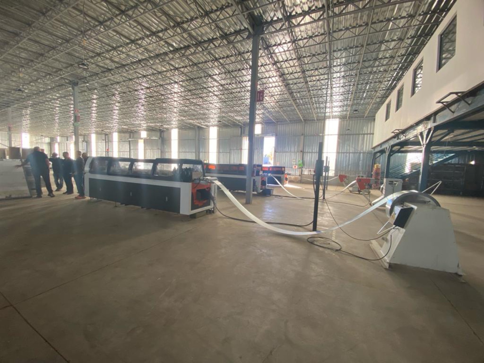 Master steel coils and the slitting line on the Cal Steel production floor.