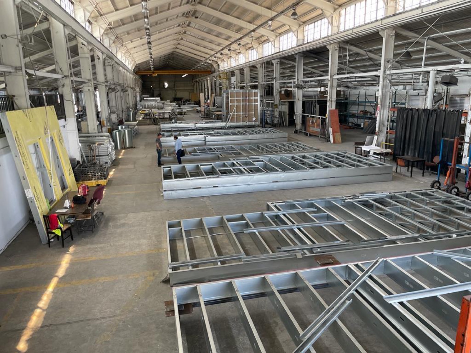 Panelized light gauge steel walls and floors laid out and built in the shop