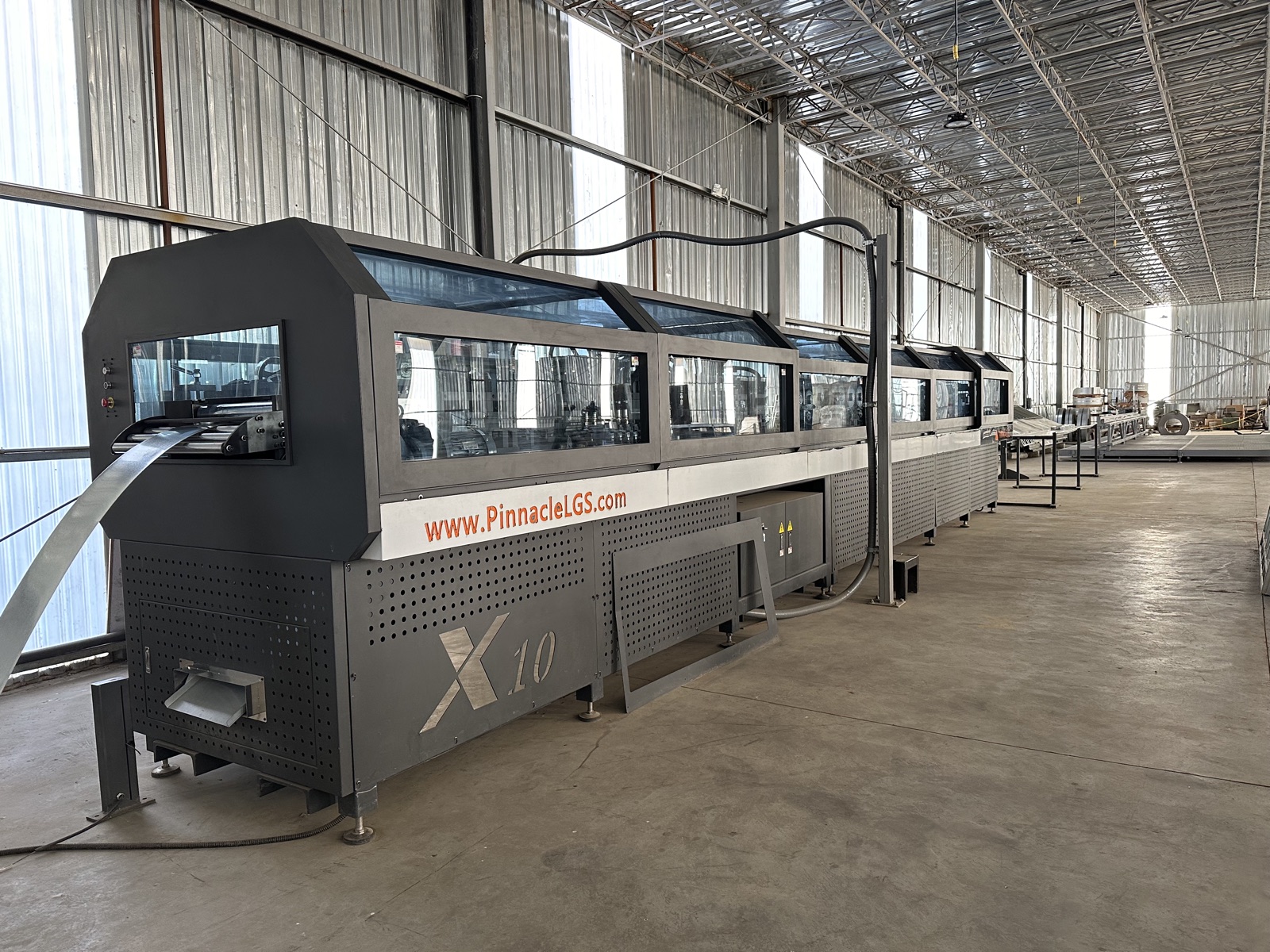 The Pinnacle X10 roll-forming line running steel on the Cal Steel factory floor