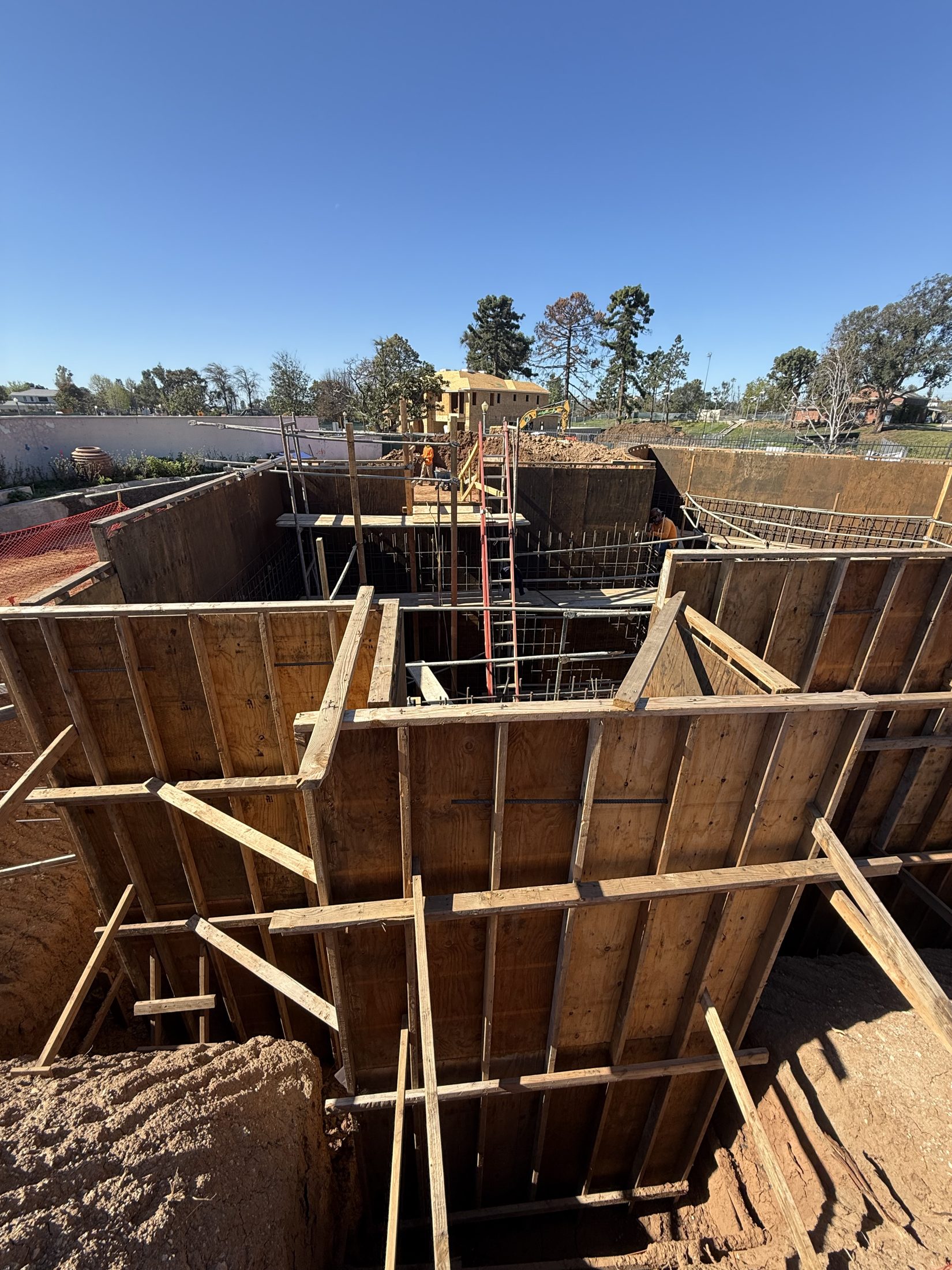 The deep basement excavation, shored in timber at 777 Ocampo