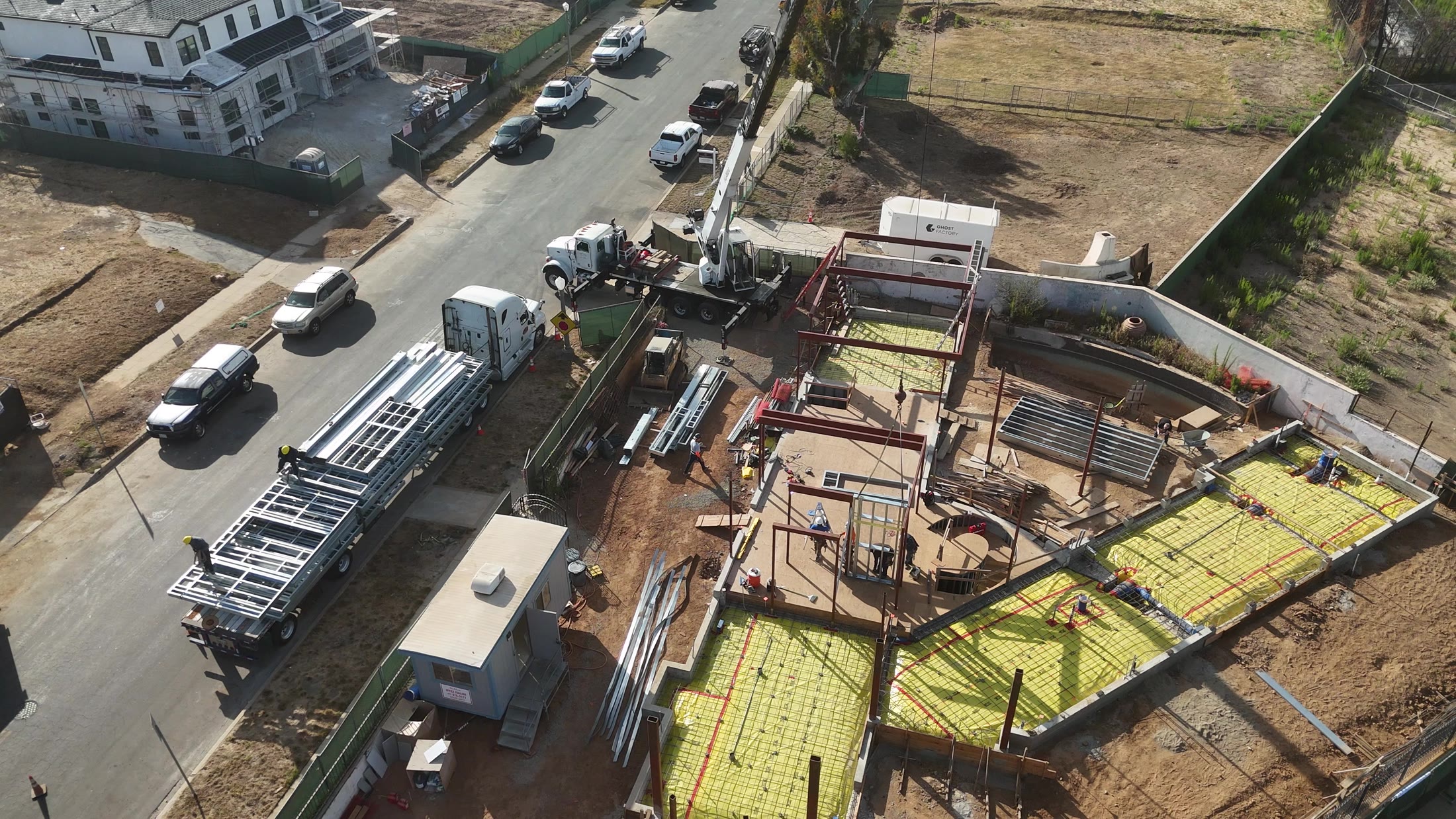 Aerial flyover of the structural steel frame taking shape across the full site at 777 Ocampo, Pacific Palisades