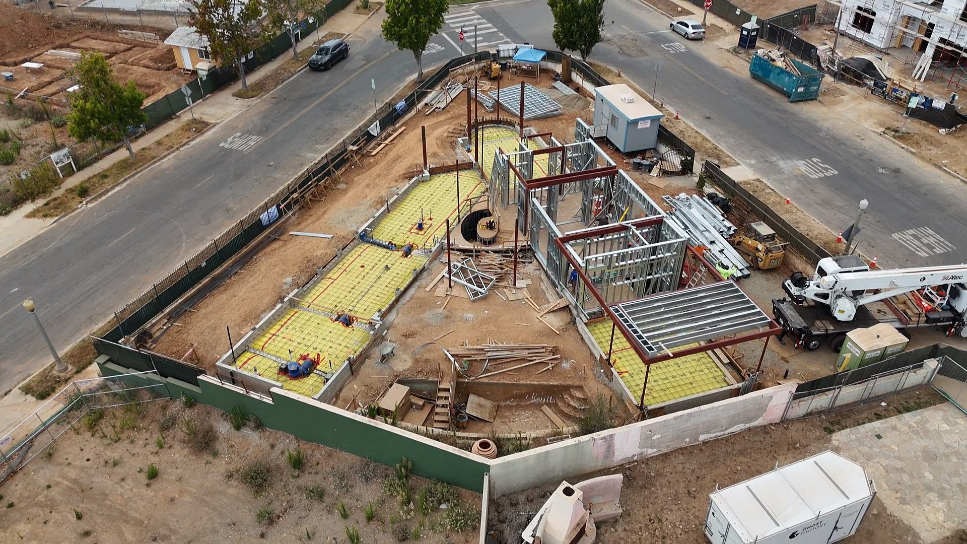 Aerial overview of the structural steel frame taking shape at 777 Ocampo